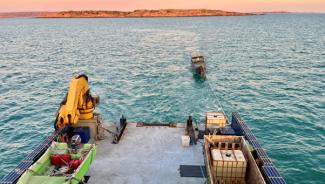 Indonesian fishing vessel being towed