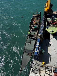 Indonesian fishing vessel being towed